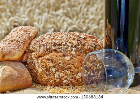 Bread and wine glass in front of the cereal box