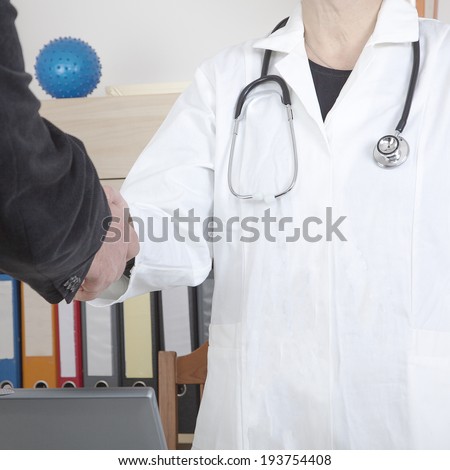 Family doctor welcomes patients in the meeting room