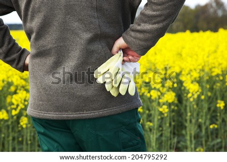Farmer with work gloves prior field