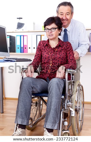 Woman in wheelchair can help in Office