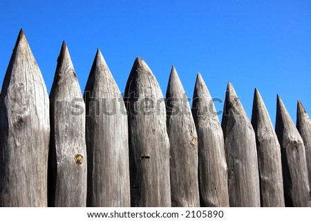Old fence on a background blue sky