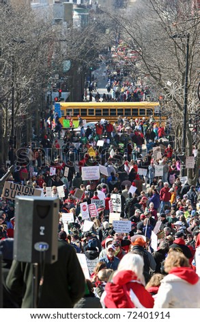 MADISON, WI - FEB 19: Unidentified people protest WI Budget Repair Bill on February 19, 2011 looking down State Street in Madison, WI.  Thousands of people gather to march and protest the bill.