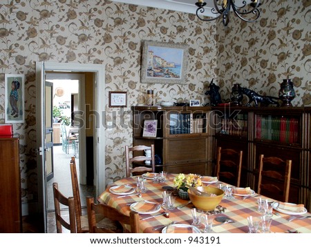 French Dining Room - Table set for lunch in a French provincial dining room.