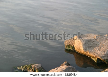 Water and Rock - Sunset reflections on calm water