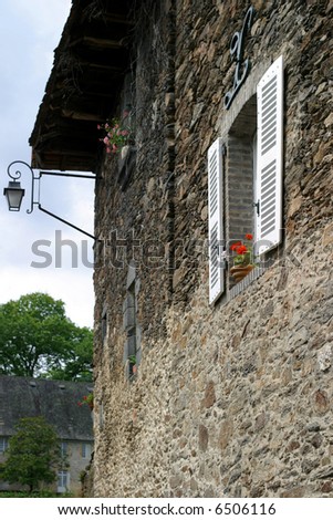 Window with Geraniums - side wall of a picturesque Limousin limestone house
