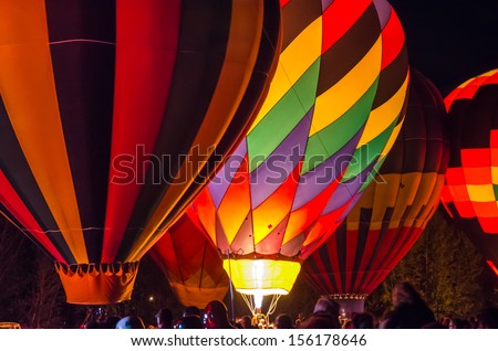 Bright Hot Air Balloons Glowing at Night
