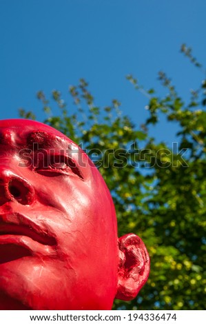 VANCOUVER, BC, CANADA - AUG 15, 2010 - Close up of Chinese sculptor Wang Shugang\'s bright red art piece \
