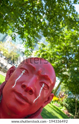 VANCOUVER, BC, CANADA - AUG 15, 2010 - Close up of Chinese sculptor Wang Shugang\'s bright red art piece \