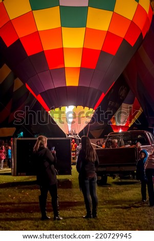 HIGH RIVER, ALBERTA, CANADA - SEPT. 26:  Colorful hot air balloons brightly lit during the 