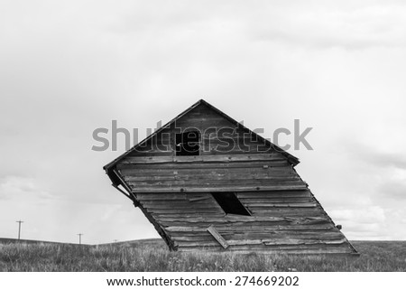 Old grain shed leaning to the side shot in black & white to give rustic feel.\
Possible concept for standing strong against adversity