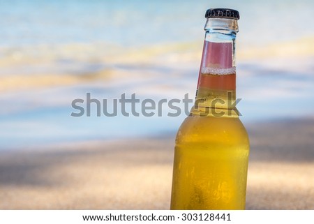 Cool refreshing alcoholic drink in the sand & shade next to the ocean