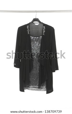 female black clothes hanging on clothes rack