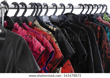 Row of colorful fashion clothing on hanging