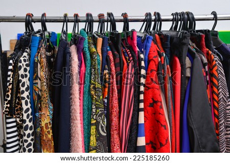 Set of colorful female fashion clothing on hanging