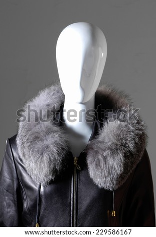 Winter fashion fur coat dress on mannequin