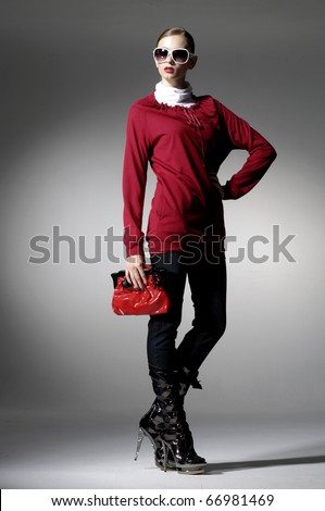 stock photo high fashion model in modern clothes hold purse posing