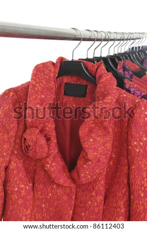 Variety of casual winter red coat fashion clothing on hanging