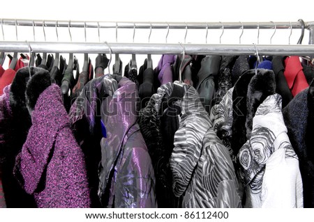 Row of elegant female fashion coat on hanging