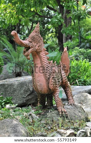 Red Singha dragon sculpture  is in the garden.It is for field decoration
