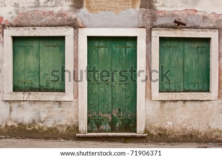 old wooden green door and windows