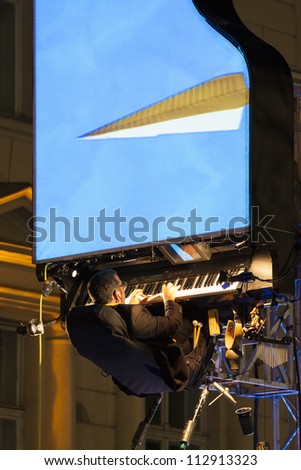 BUCHAREST, ROMANIA - SEPTEMBER 13: David Moreno performs his Floten Tecles show during B-FIT in the Street International Street Theater Festival on September 13, 2012 in Bucharest, Romania.
