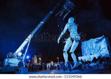 BUCHAREST, ROMANIA - SEPTEMBER 16: La Fura dels Baus performs with giant puppet  during B-FIT in the Street,  International Street Theater Festival on September 16, 2012 in Bucharest, Romania.