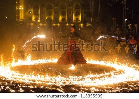 BUCHAREST, ROMANIA - SEPTEMBER 13: Lara Castiglioni performs Snow of Fire show during B-FIT in the Street, International Street Theater Festival on  September 13, 2012 in Bucharest, Romania.