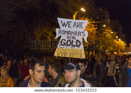 BUCHAREST, ROMANIA - SEPT 22: Unidentified people protest for the 22nd day against the plan to open Europe\'s largest open-cast goldmine in the Rosia Montana on Sept 22, 2013 in Bucharest, Romania.