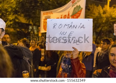 BUCHAREST, ROMANIA - SEPT 22: Unidentified people protest for the 22nd day against the plan to open Europe\'s largest open-cast goldmine in the Rosia Montana on Sept 22, 2013 in Bucharest, Romania.