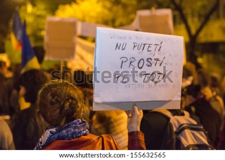 BUCHAREST, ROMANIA - SEPT 22: Unidentified people protest for the 22nd day against the plan to open Europe's largest open-cast goldmine in the Rosia Montana on Sept 22, 2013 in Bucharest, Romania.