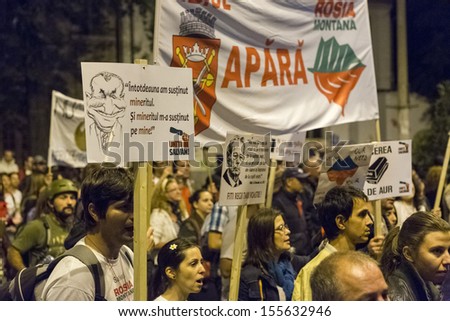 BUCHAREST, ROMANIA - SEPT 22: People join the protests for the 22nd day against the plan to open Europe\'s largest open-cast goldmine in the Rosia Montana on Sept 22, 2013 in Bucharest, Romania.