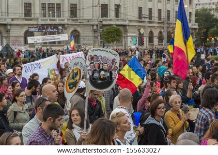 BUCHAREST, ROMANIA - SEPT 22: People join the protests for the 22nd day against the plan to open Europe's largest open-cast goldmine in the Rosia Montana on Sept 22, 2013 in Bucharest, Romania.