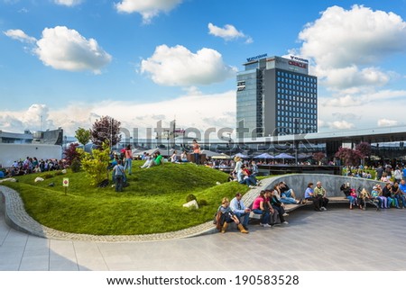 BUCHAREST, ROMANIA - MAY 1: Unidentified people relax at recreation area in Promenada Mall on May 1, 2014 in Bucharest, Romania. The mall received Building of the Year SEE 2014 at CEEQA Gala, Warsaw.
