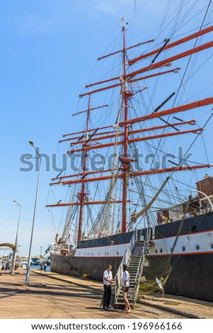CONSTANTA, ROMANIA - MAY 27, 2014: Two unidentified members of the Sedov tall ship crew wait for the passengers to board during Black Sea Tall Ships Regatta in Constanta port.