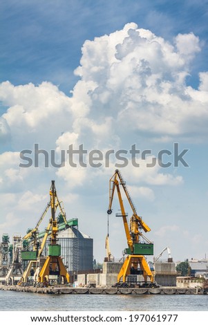 CONSTANTA, ROMANIA - MAY 27, 2014: Industrial port quay with heavy load gantry cranes in Constanta port, the largest on the Black Sea and the 18th largest in Europe.