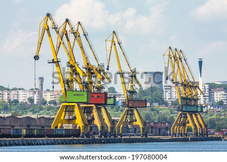 CONSTANTA, ROMANIA - MAY 27, 2014: Industrial port quay with heavy load gantry cranes in Constanta port, the largest on the Black Sea and the 18th largest in Europe.