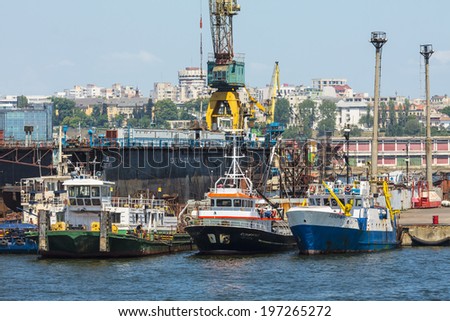 CONSTANTA, ROMANIA - MAY 25, 2014: Tugboats docked in the shipyard of commercial port of Constanta, the largest port on the Black Sea and the 18th largest in Europe.