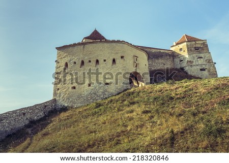 Medieval aged defense tower and walls of Rasnov citadel in Rasnov city, Brasov county, Romania.