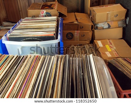 vinyl records stored in containers and boxes