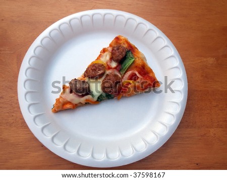 a slice of fresh baked sausage, spinach, pepper and onion pizza on a white foam plate