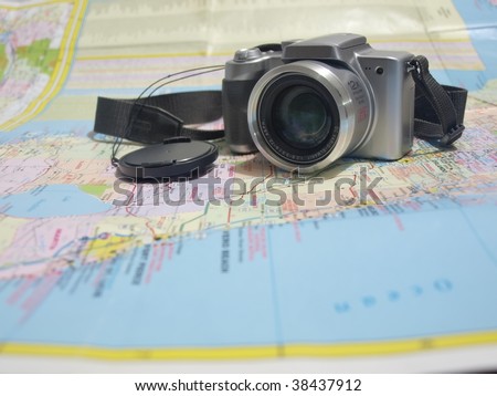 photo of a camera on a road map of the state of Florida. This is a concept photo for travel and tourist related subjects.