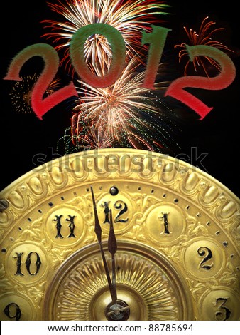 Close up of the minute hand of a antique clock face about to strike 12 o-clock midnight to start the 2012  new year with fireworks in the background.