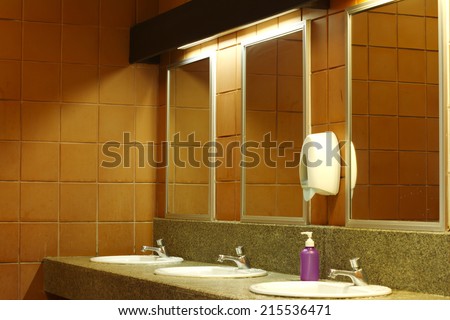 The sinks in a modern public rest room.