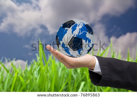 hand holding the earth