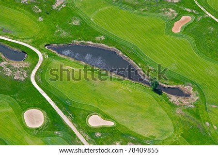 Aerial view of golf course and water