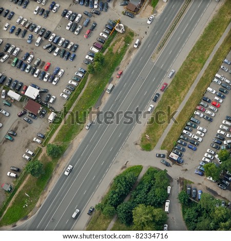 vertical aerial view over highway and parking places