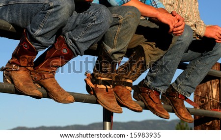 Well worn boots adorn the wranglers at rodeo in small county fair, Idaho