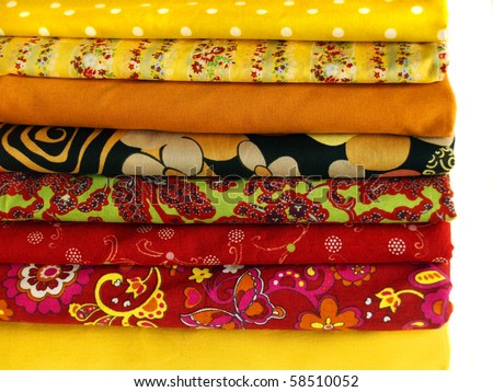 Different kind of cotton on a white background. Bright fabrics for site design