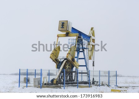 Operating oil and gas well isolated on snow white background