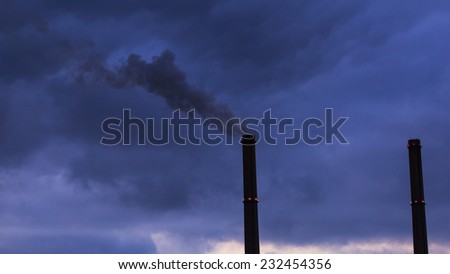 Black smoke spewed from coal powered plant smoke stacks